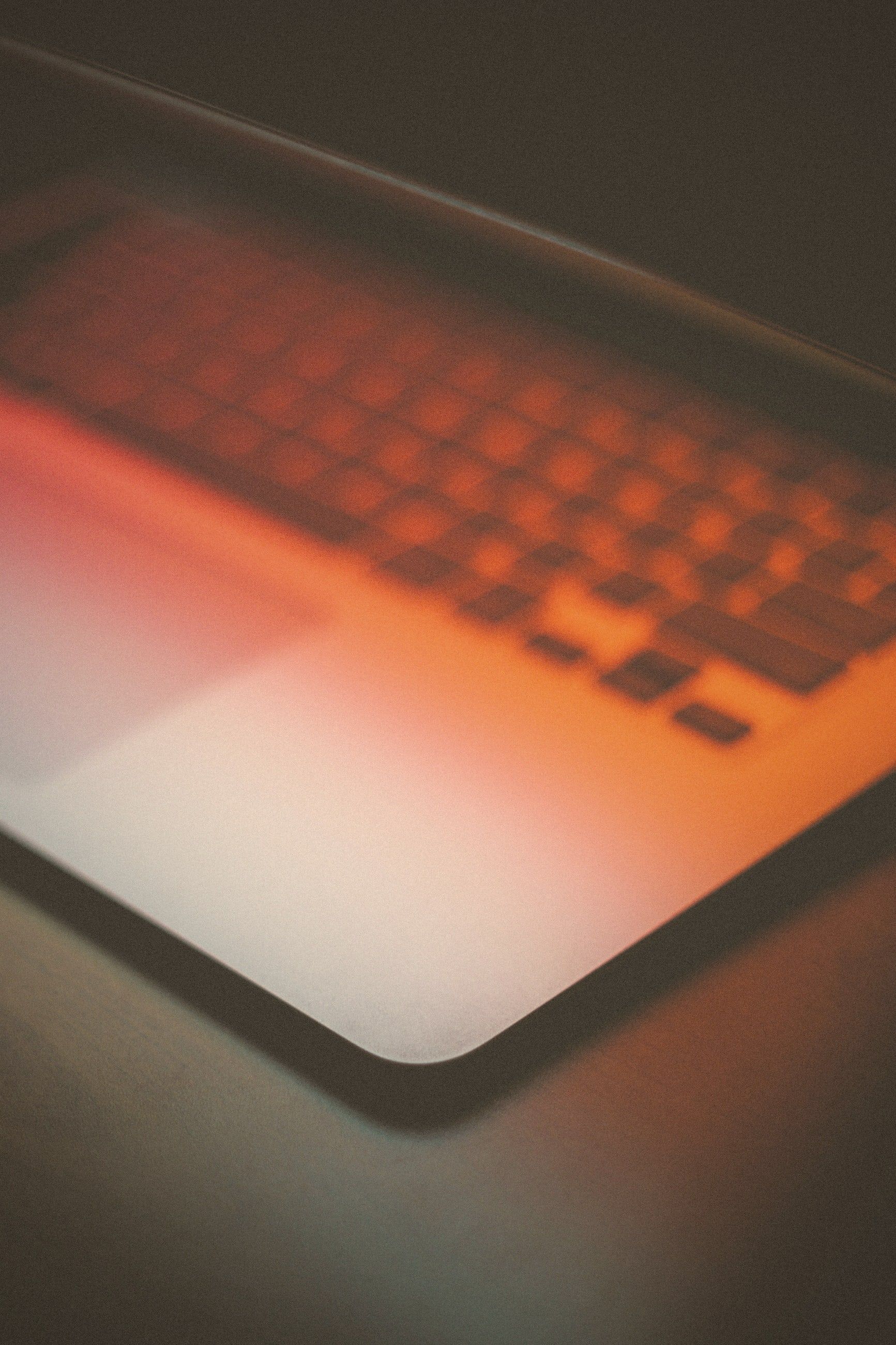 A keyboard in warm orange light, close up